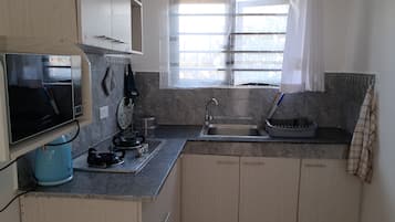 Standard Studio, Garden View | Private kitchen | Shared microwave