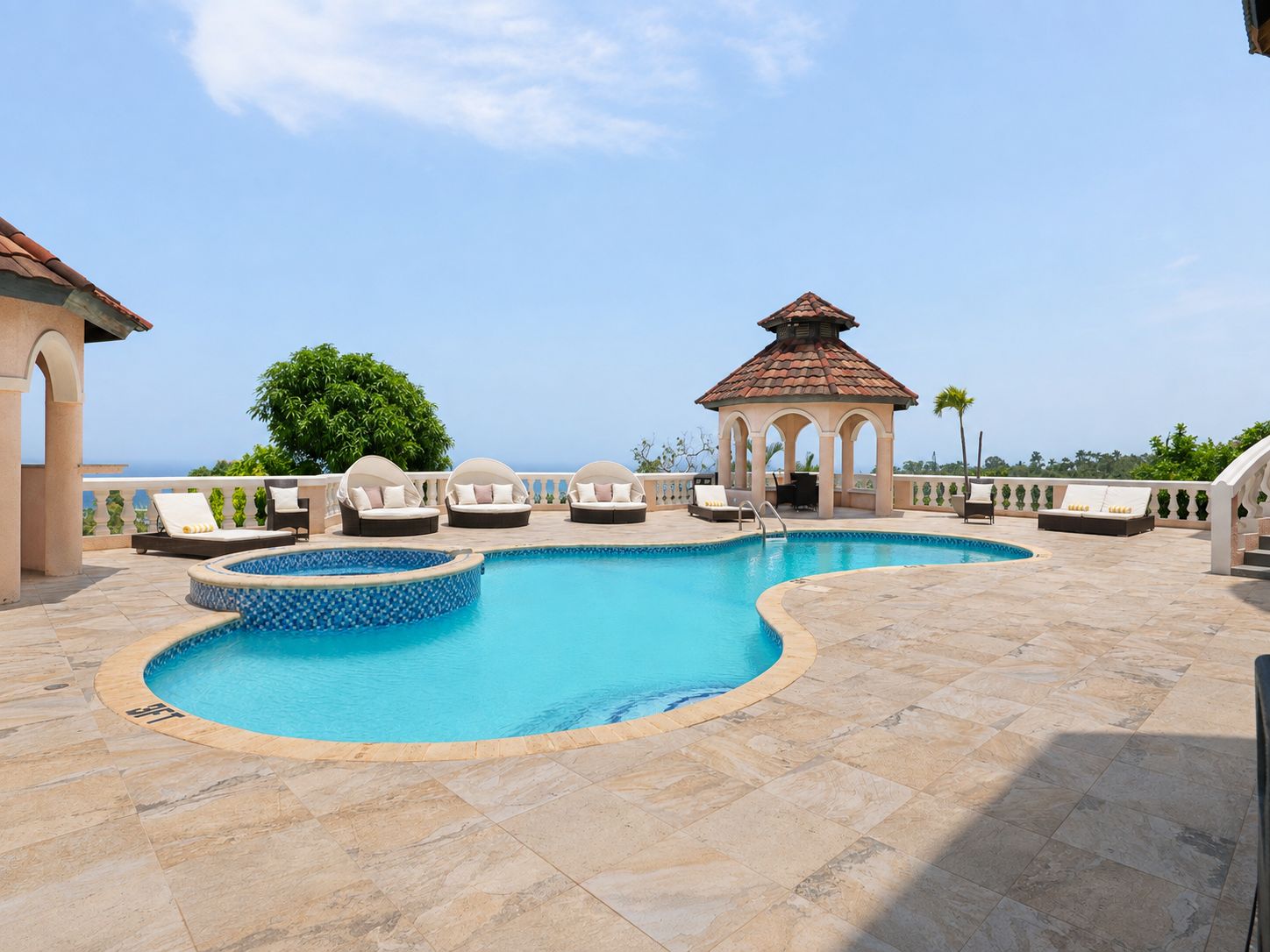 A pool area with lounge chairs and a gazebo.