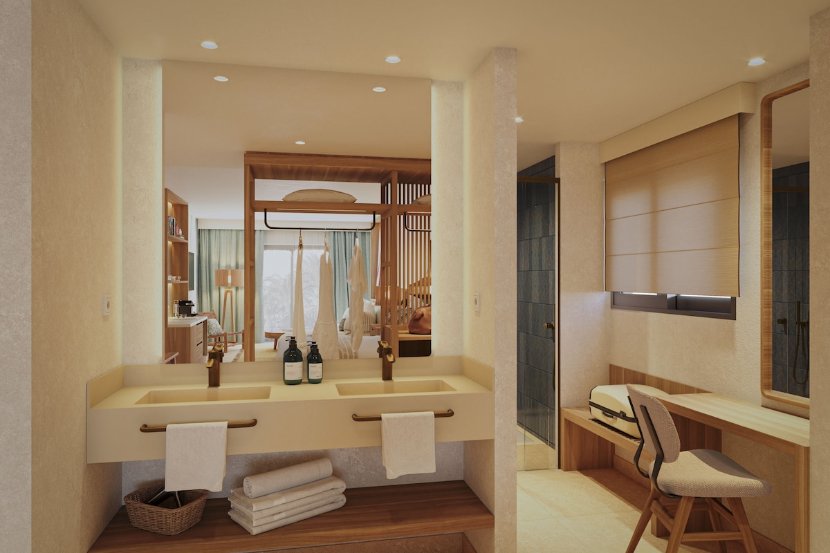 Un baño moderno con lavamanos doble, un espejo y un banco de madera.