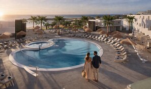 A pool area with lounge chairs and umbrellas, overlooking a beach and ocean. - HD Sensarena (Teguise)