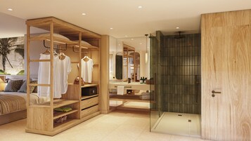 Un baño moderno con tocador de madera, cabina de ducha de vidrio y un espejo grande.