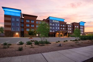 A multi-story hotel with a modern design, featuring a prominent Staybridge Suites sign. - Staybridge Suites Scottsdale - Talking Stick (Tonopah)