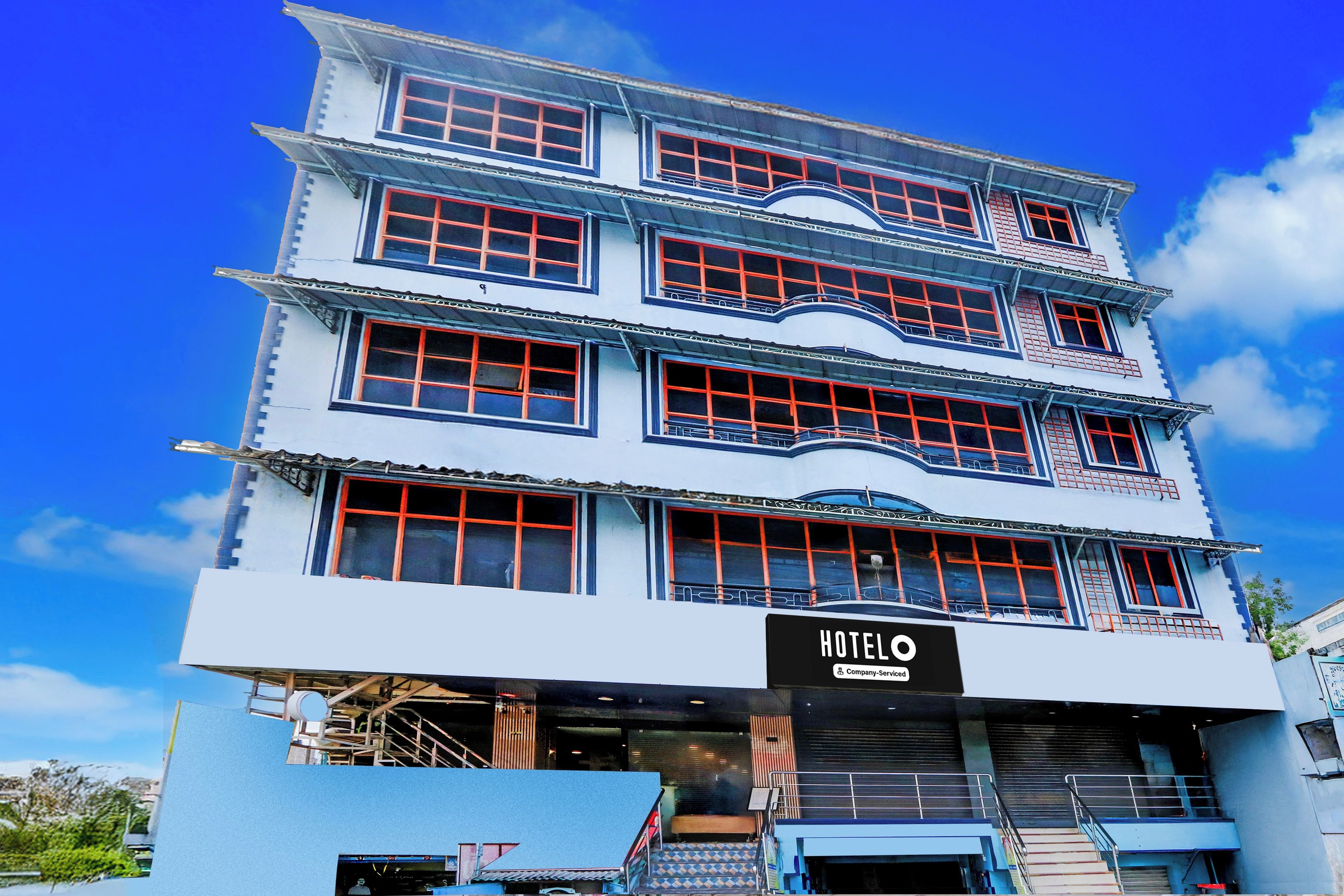 A multi-story hotel with a prominent 'HOTEL' sign at the ground level.