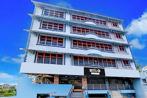 A multi-story hotel with a prominent 'HOTEL' sign at the ground level.