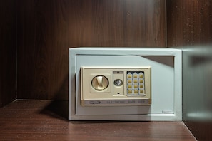 A microwave with a keypad and a dial, labeled "WORLD ELECTRONIC SAFE 25EA." - SHRI VRINDAVAN (Bangkok)