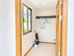 A small, clean bathroom with a window, a shower, and a toilet. - Brand New Private 3-Bedroom Pool Villa in Bang Tao, Phuket (Thep Krasatti)