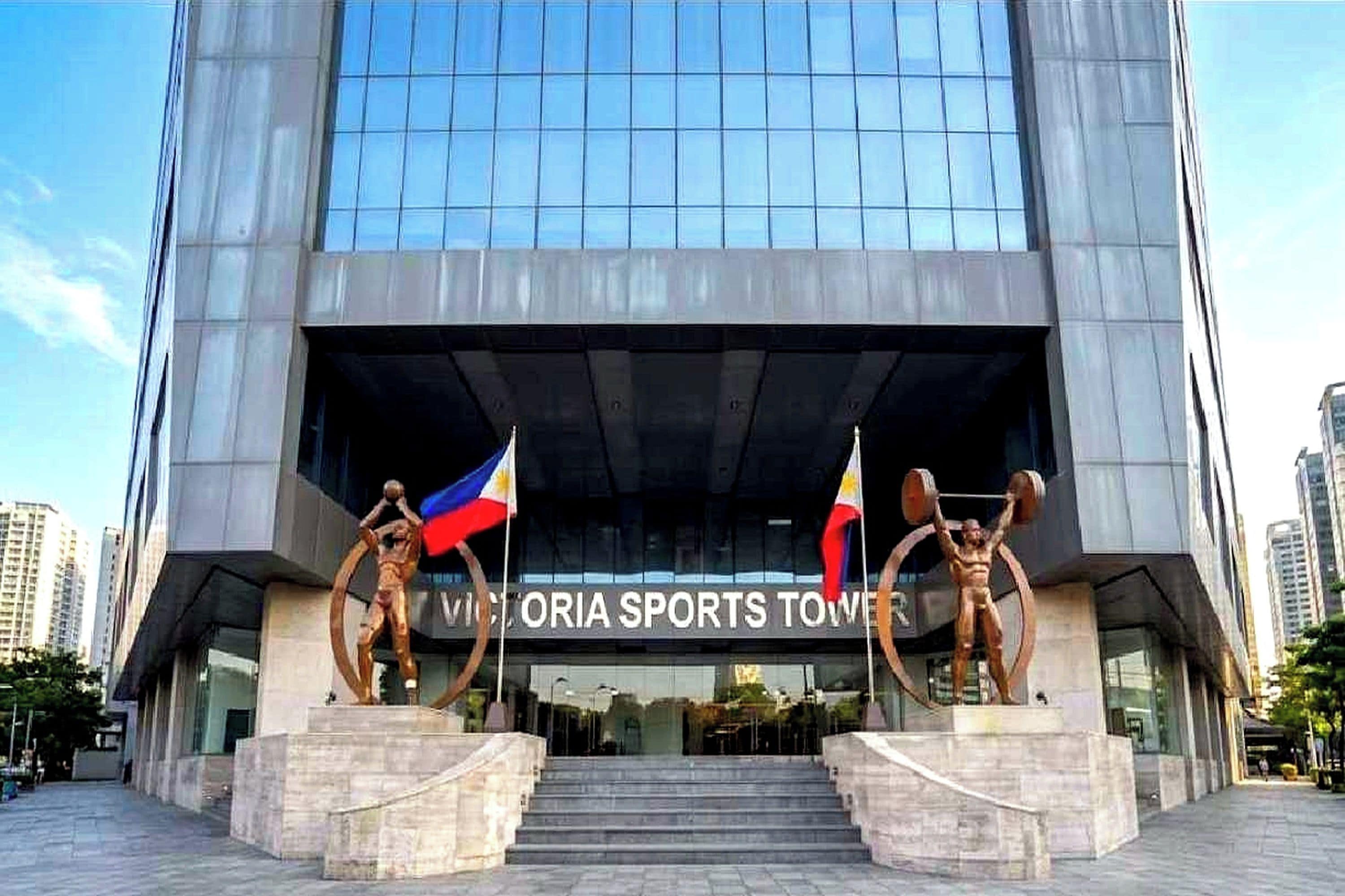 A modern building with a sign reading 'Victoria Sports Tower'.
