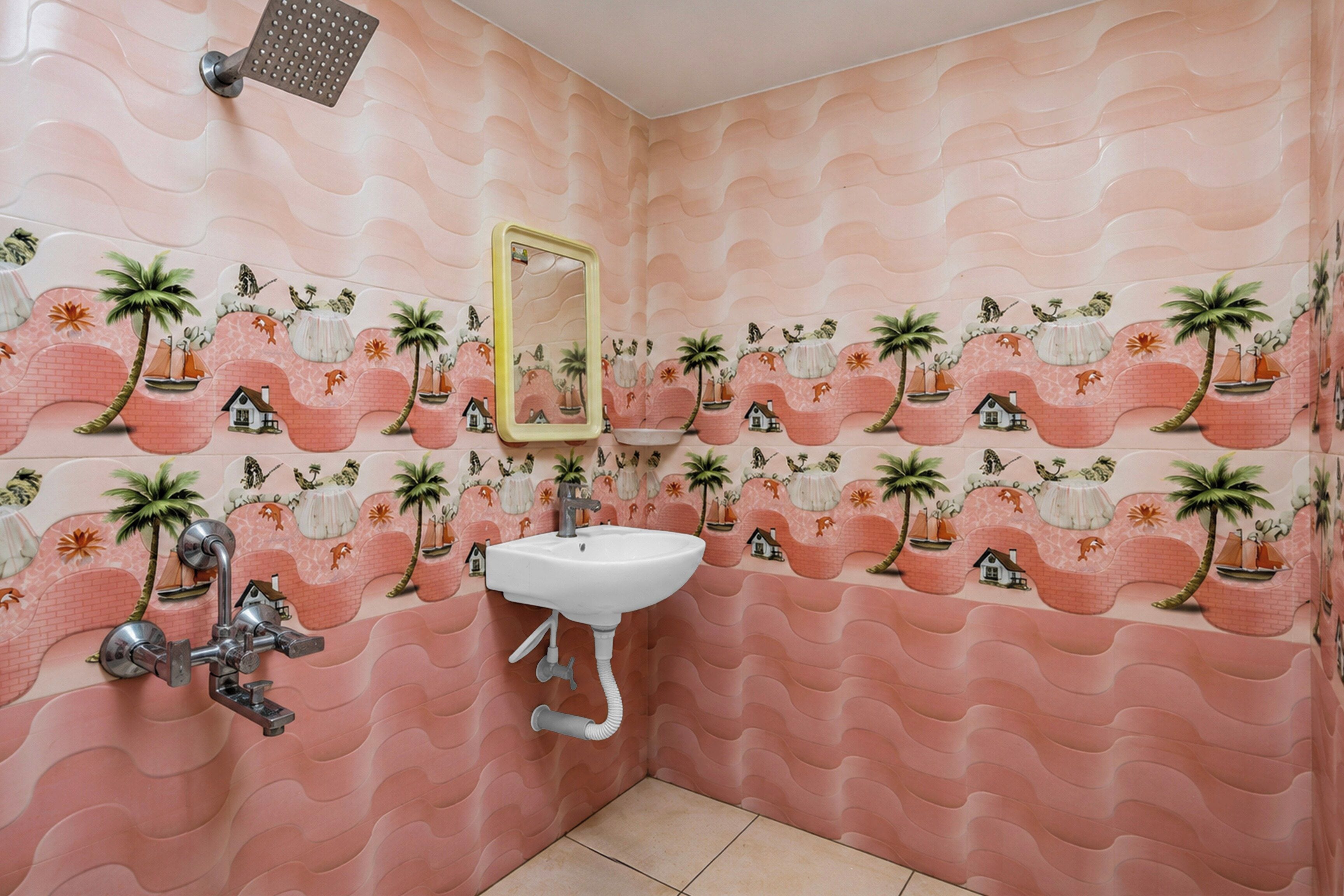 A bathroom with a sink, mirror, and shower. The walls have a wavy pattern with palm trees and houses.