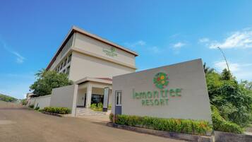 A building with a sign reading 'lemon tree resort'.