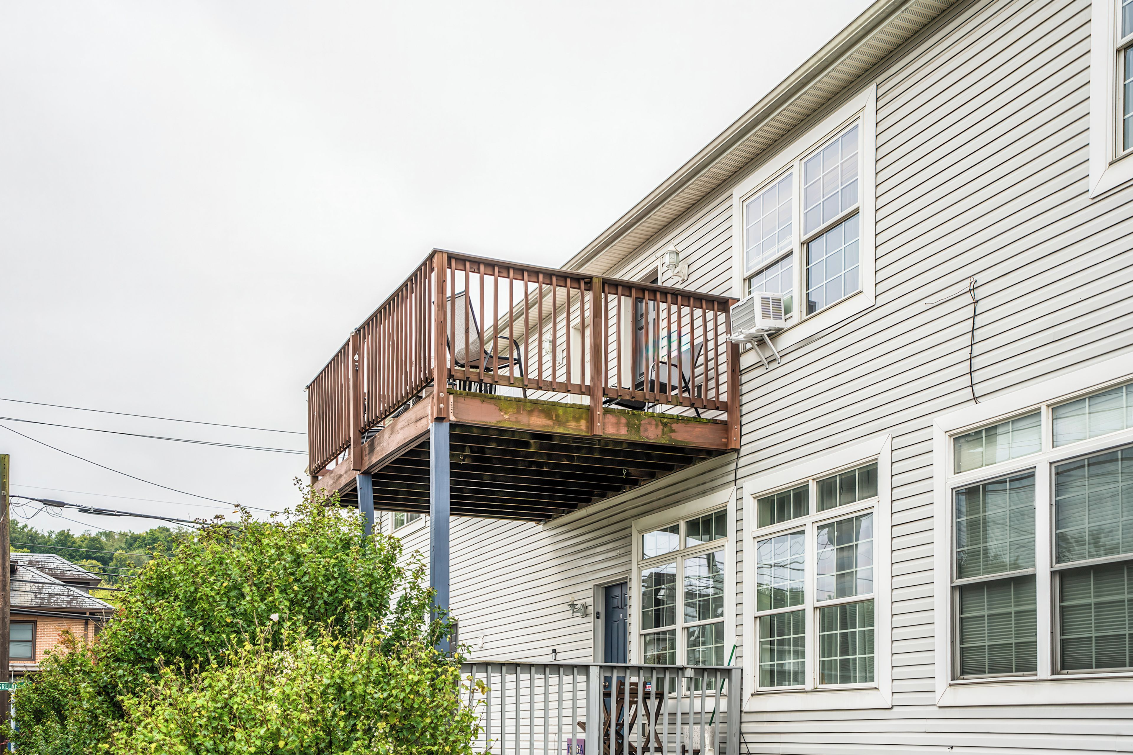 A two-story house with a balcony.