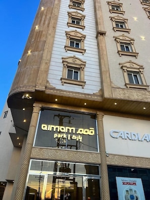 A building with a large glass entrance and a sign that reads 'CARDINAL'.