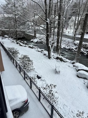 A snowy outdoor area with a bench, a car covered in snow, and a fence. - Creek & Mountain Views, Free Tickets to Area Attractions (Gatlinburg)