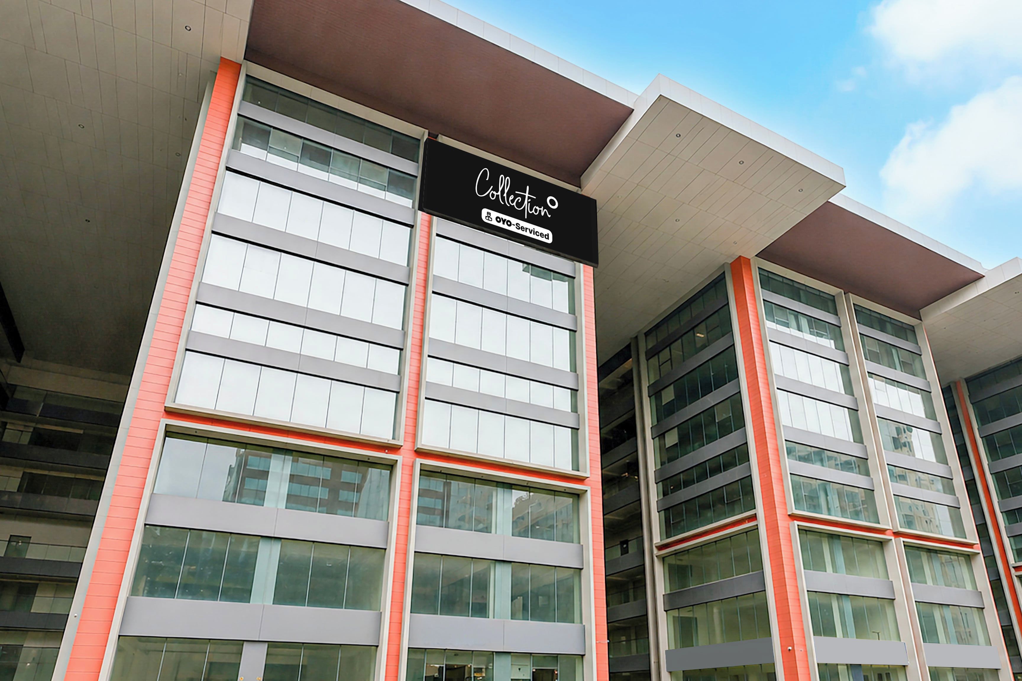 A building with a sign indicating it is serviced by a coffee shop.