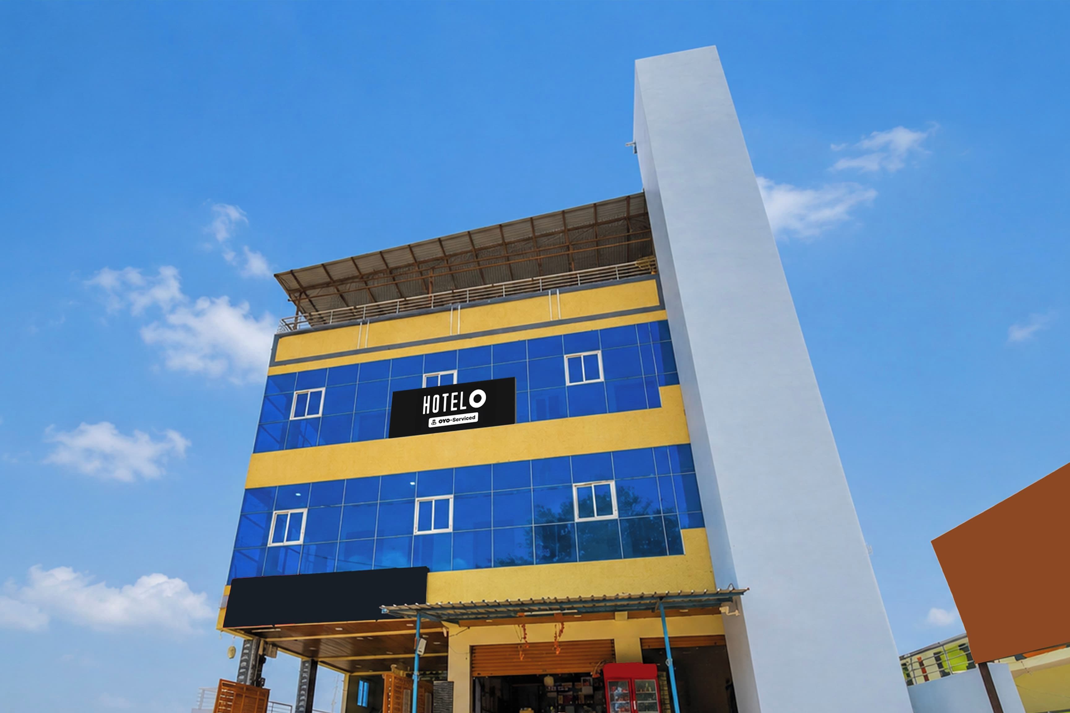 A multi-story hotel building with a prominent 'HOTEL' sign on the facade.