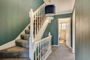 A staircase with white railings and carpeted steps leading to a door. - Spacious 4-Bed Marina Home, Parking, Near City (Liverpool)