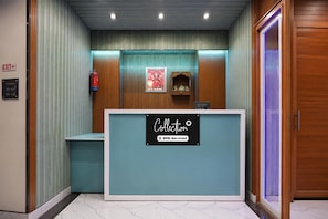 A reception desk with a sign indicating it is serviced by YOYO.