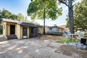A small, single-story building with a porch and a patio area. - Near Dtwn Jackson: Home w/ Screened Porch (Jackson)