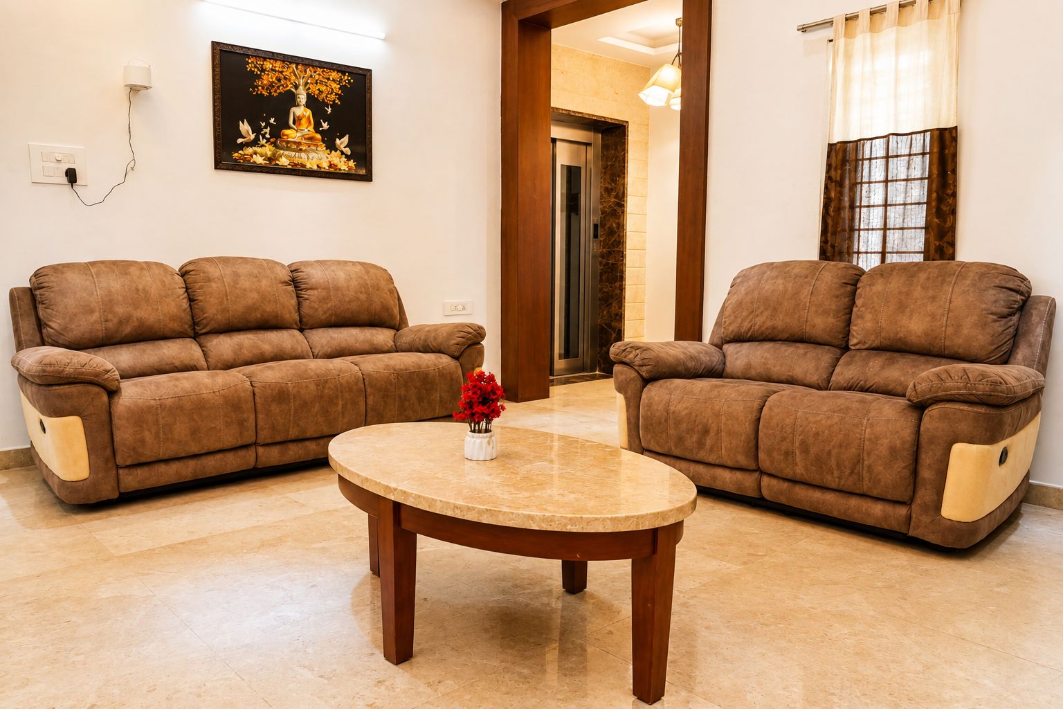 A living room with two brown sofas, a round coffee table, and a framed picture on the wall.