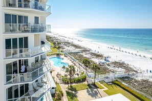 A multi-story hotel with a pool area, beach access, and a view of the ocean. - Sterling Sands 604 2 Bedroom Condo (Destin)
