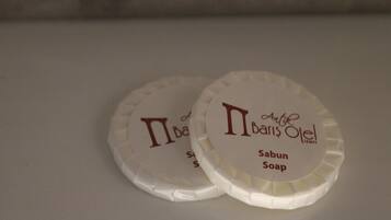 Two round soap bars with text on them.