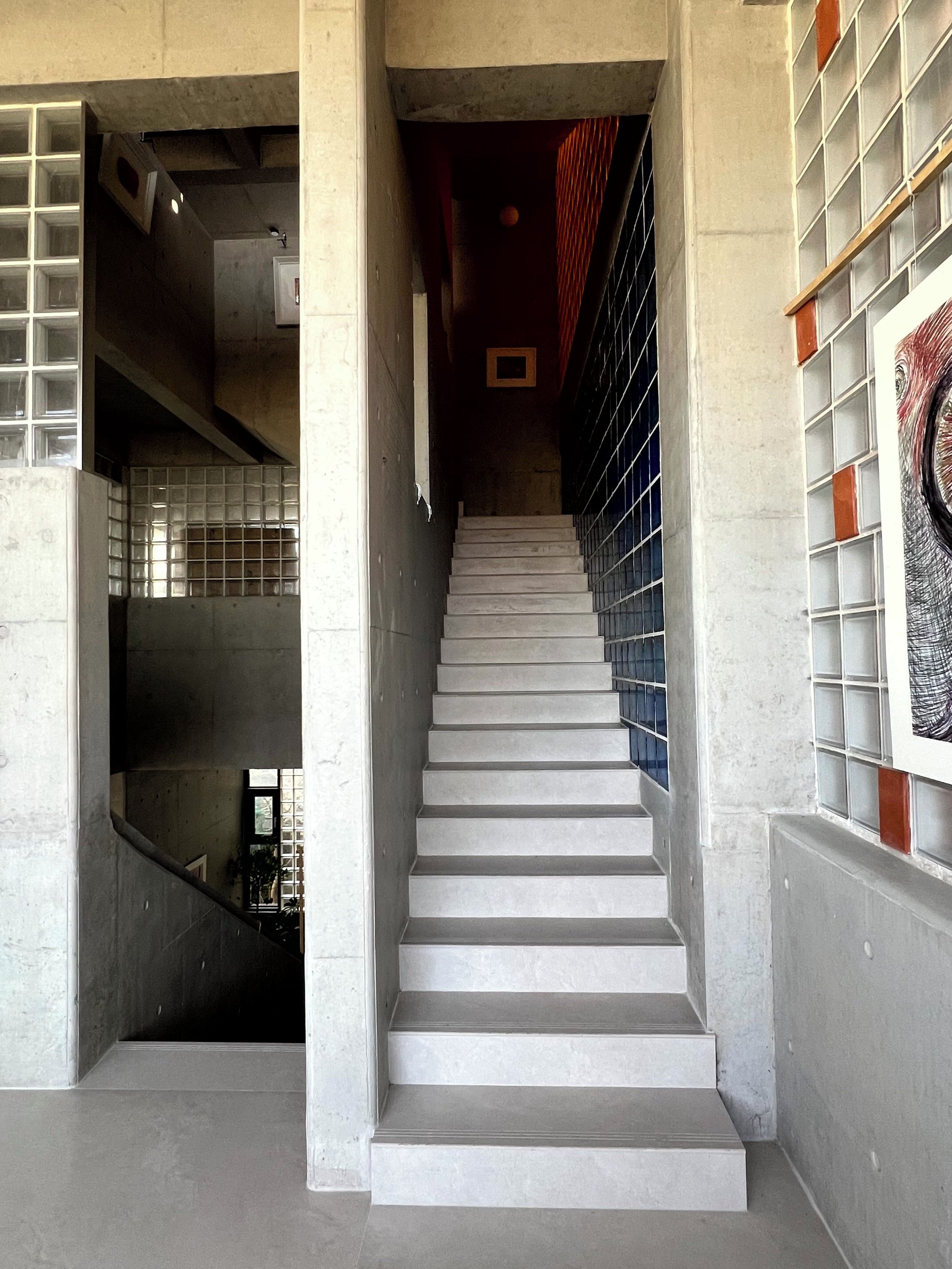 A staircase with a modern design, leading to a lower level.