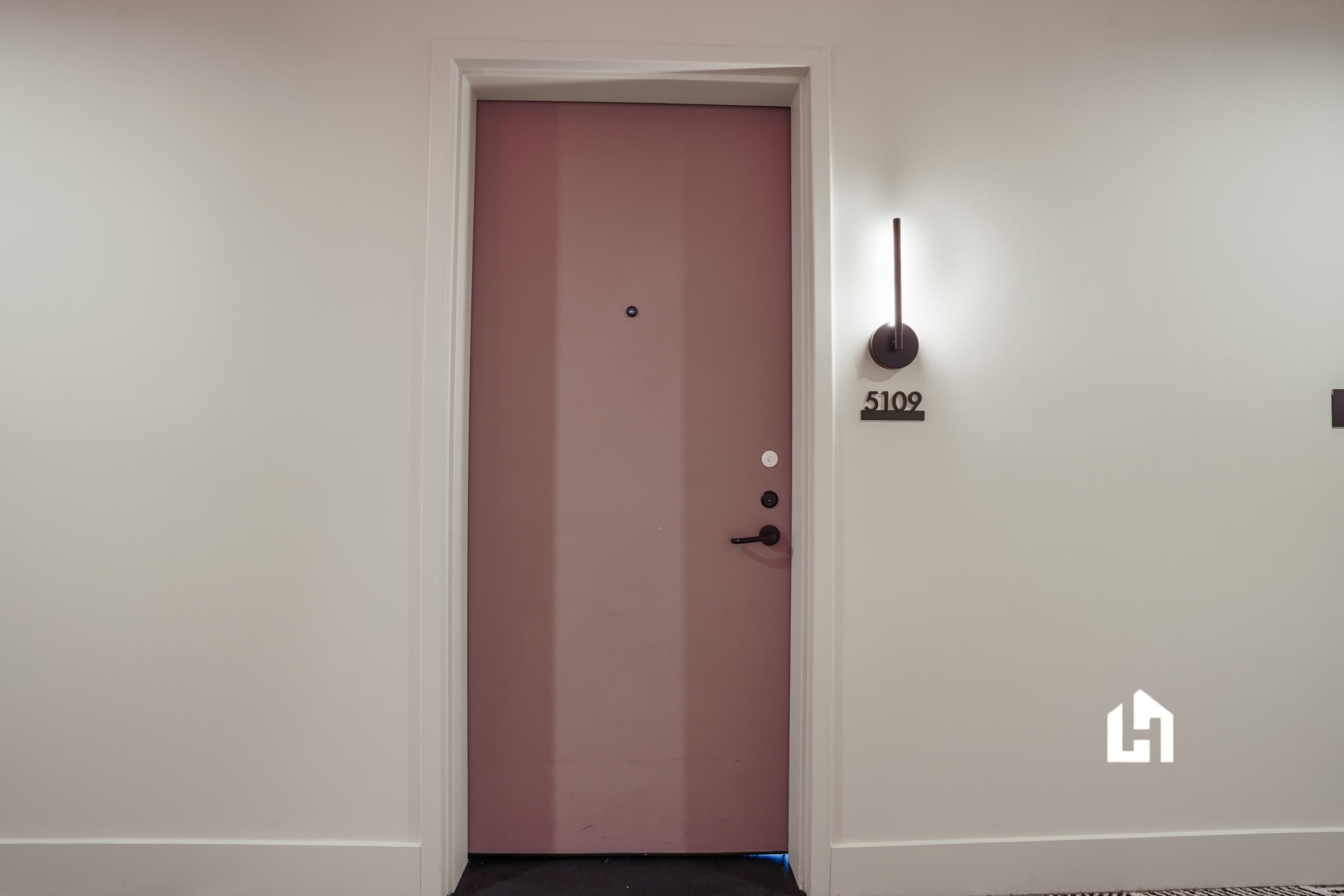 A closed door with a number plate indicating room 5102.