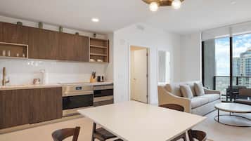 Gather around the dining table in the open living space with plenty of natural light.