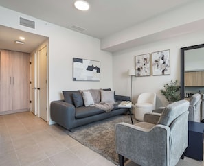 Relax in this living area with comfortable seating and full of natural light.  - 37th Floor Studio: Ocean Views & Pool Access (Miami)