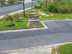 A parking lot with a sign for Gulfpoint Condominiums at 200 Padre Blvd. - Walk to the Beach | Pool, Pickleball & Tennis SPI Permit #2025-0205 (South Padre Island)