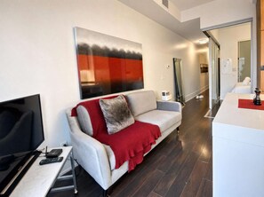 Unclassified image, 4 of 14, button - RivetStays | The Atmos Deluxe Suite – 1 Bedroom Condo (Toronto)