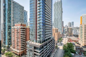 A high-rise building with multiple floors, large windows, and a modern architectural design.