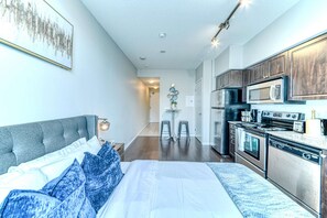 Unclassified image, 4 of 11, button - RivetStays | The Neptune Executive Suite – Modern Studio (Toronto)