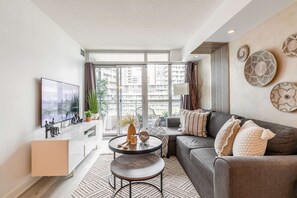 Living area - RivetStays - Parade CityPlace | 2BR 2BA Sofa Bed Suite (Toronto)