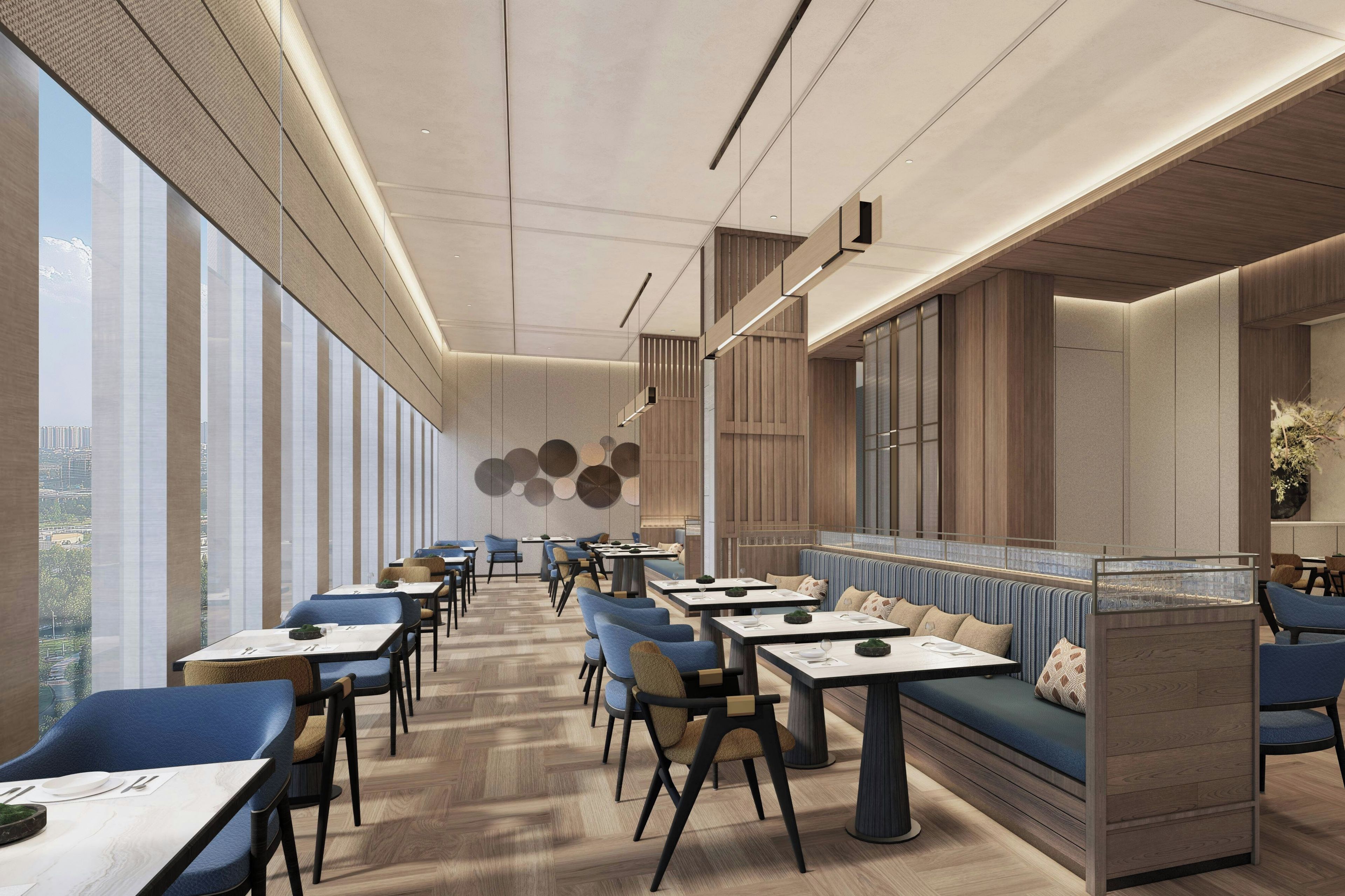 A modern restaurant interior with high ceilings, large windows, and a mix of seating arrangements including tables and booths.
