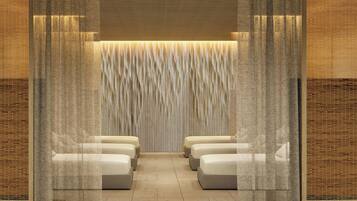 A room with a seating area featuring cushioned benches and a textured wall.