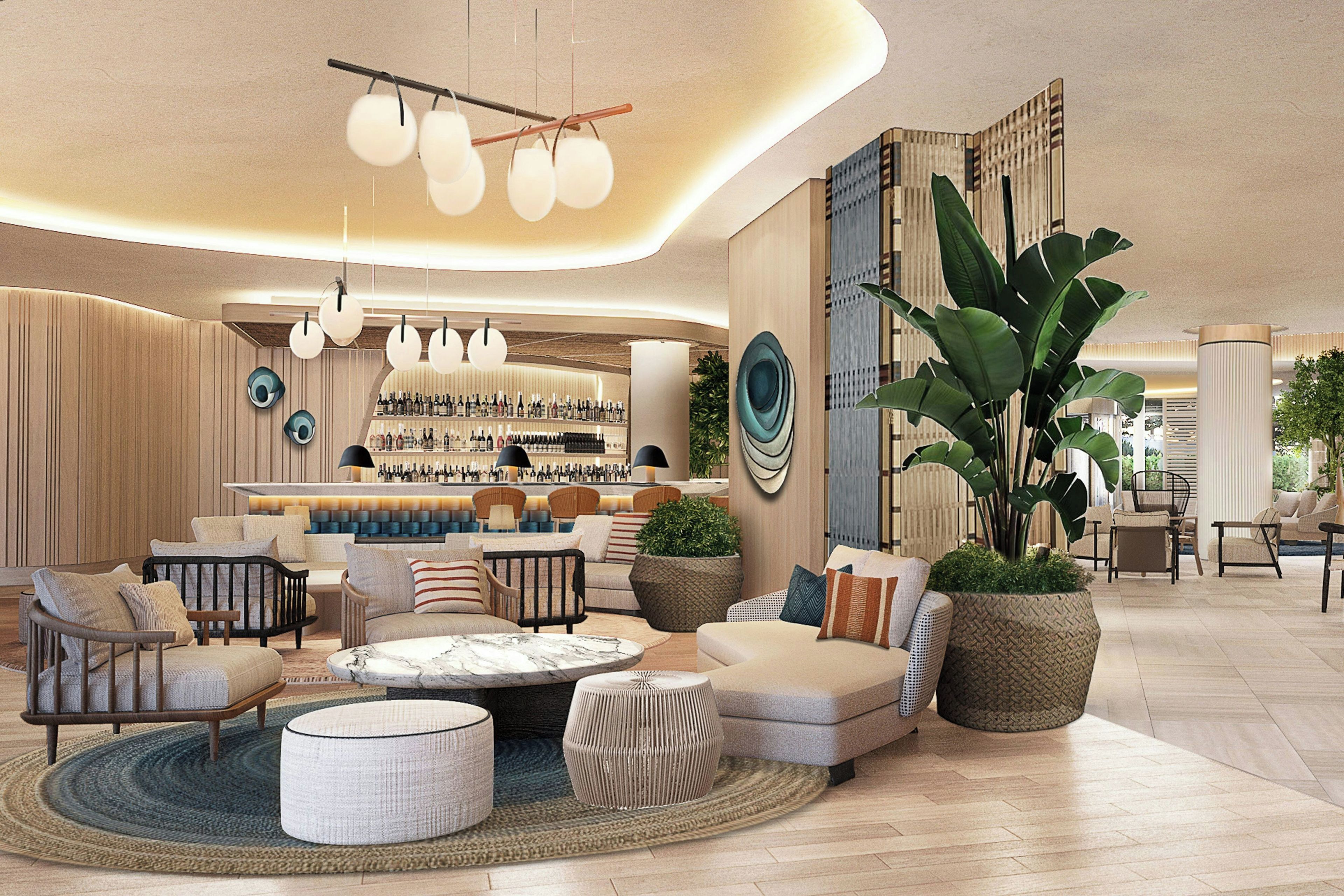 Un espace détente moderne avec des sièges, un bar et une grande plante en pot.