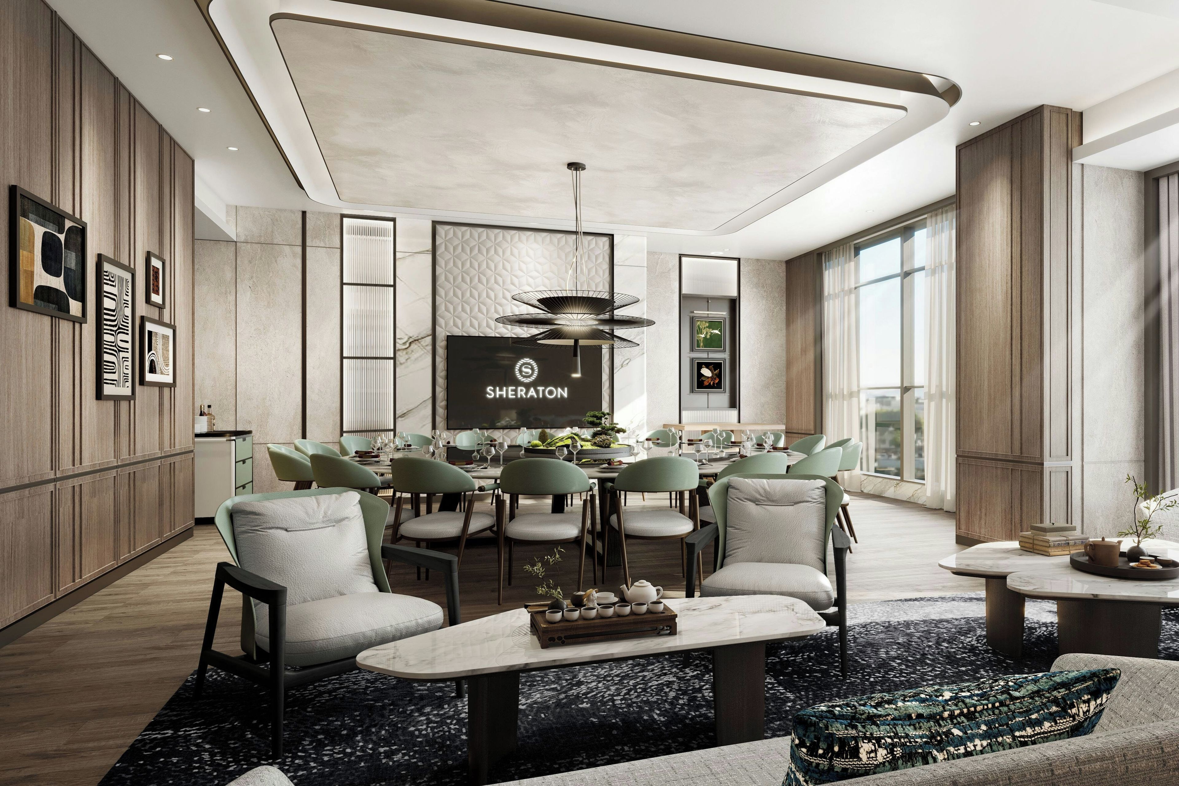 A modern dining area with a central table, surrounded by chairs, and a large screen displaying the Sheraton logo.