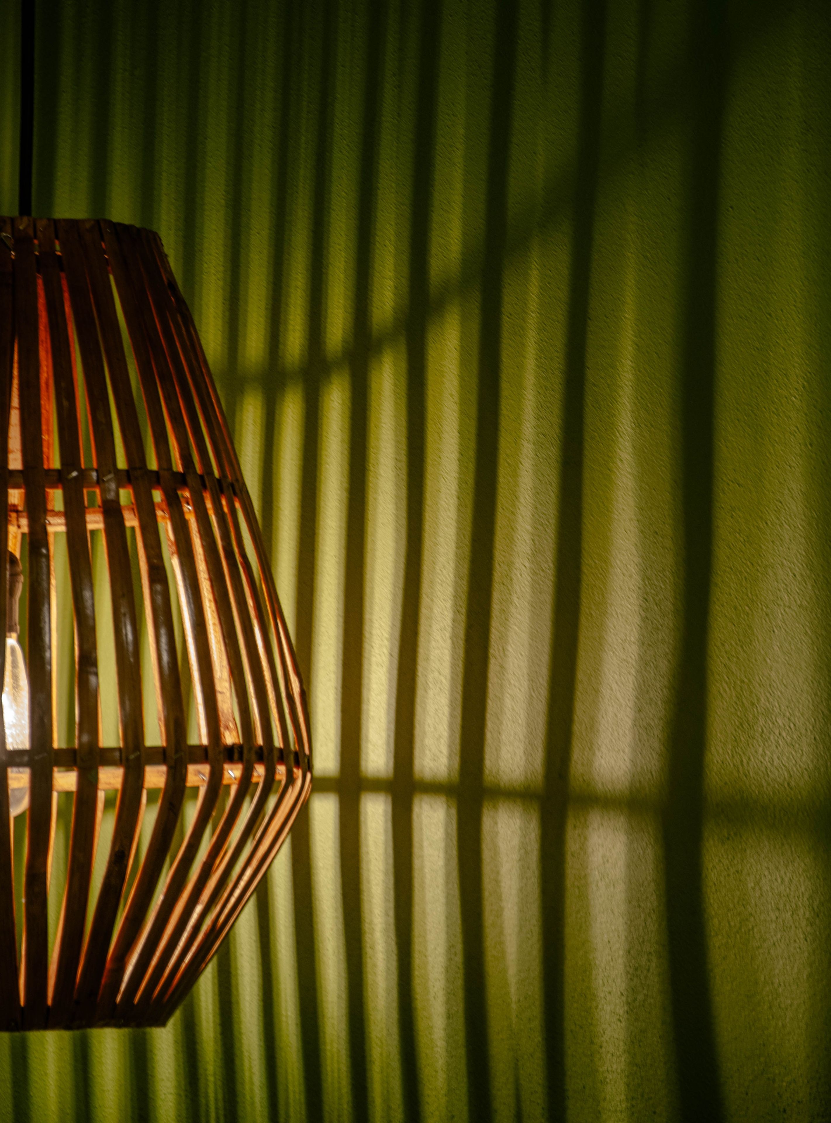 A hanging light fixture with a geometric pattern.