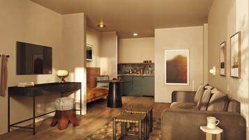 A modern living room with a sofa, a coffee table, and a dining area with a table and chairs.