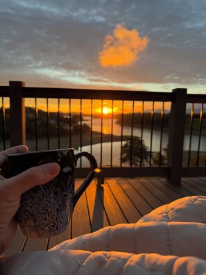 A person holding a mug on a wooden deck with a sunset view. - Entire Lakefront Cabin - 2 Private 1BR Suites - With Smoky Mountain View sunrise (Sevierville)
