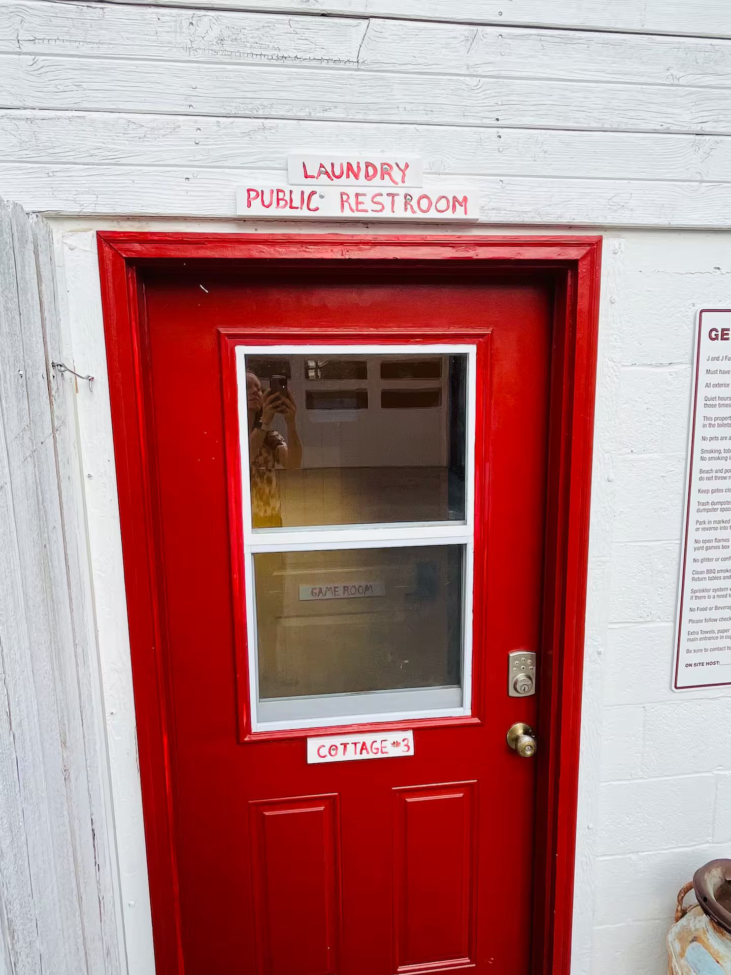 A red door with a window, labeled 'laundry public restroom' and 'cottage 3'.