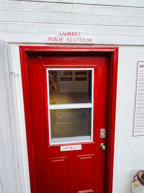 A red door with a window, labeled 'laundry public restroom' and 'cottage 3'.
