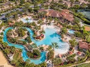 A resort with multiple swimming pools, palm trees, and lounge areas. - No Resort Fees - 2-Acre Waterpark - Disney 9 Miles to Disney - Walk to dining (Davenport)