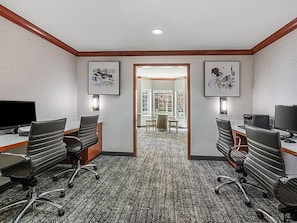 A conference room with two desks, chairs, and a carpeted floor. - Accessible Suite w/ Kitchen, Pool & Free Breakfast (Rocklin)