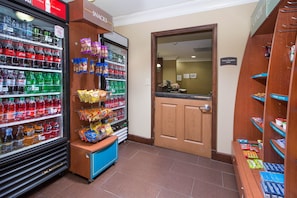 A vending area with various snacks and drinks. - Accessible 1BR Suite w/ Free Breakfast + Fire Pit (Augusta)