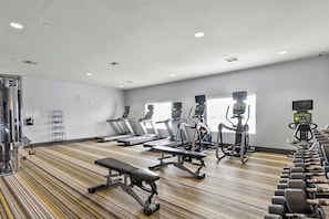 A gym with treadmills, elliptical machines, and free weights. - Endless Summer on the Warrior - Huntington Beach Meets Bama (Tuscaloosa)