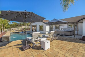 A backyard with a swimming pool, lounge chairs, and a hot tub. - Luxury Escape | Heated Pool/Spa • Views + Events (Alpine)