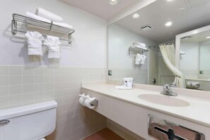 A modern bathroom with a toilet, sink, mirror, towel rack, and shower curtain. - 2 Queen Beds | Non-Smoking, Micfridge (Lake Havasu City)