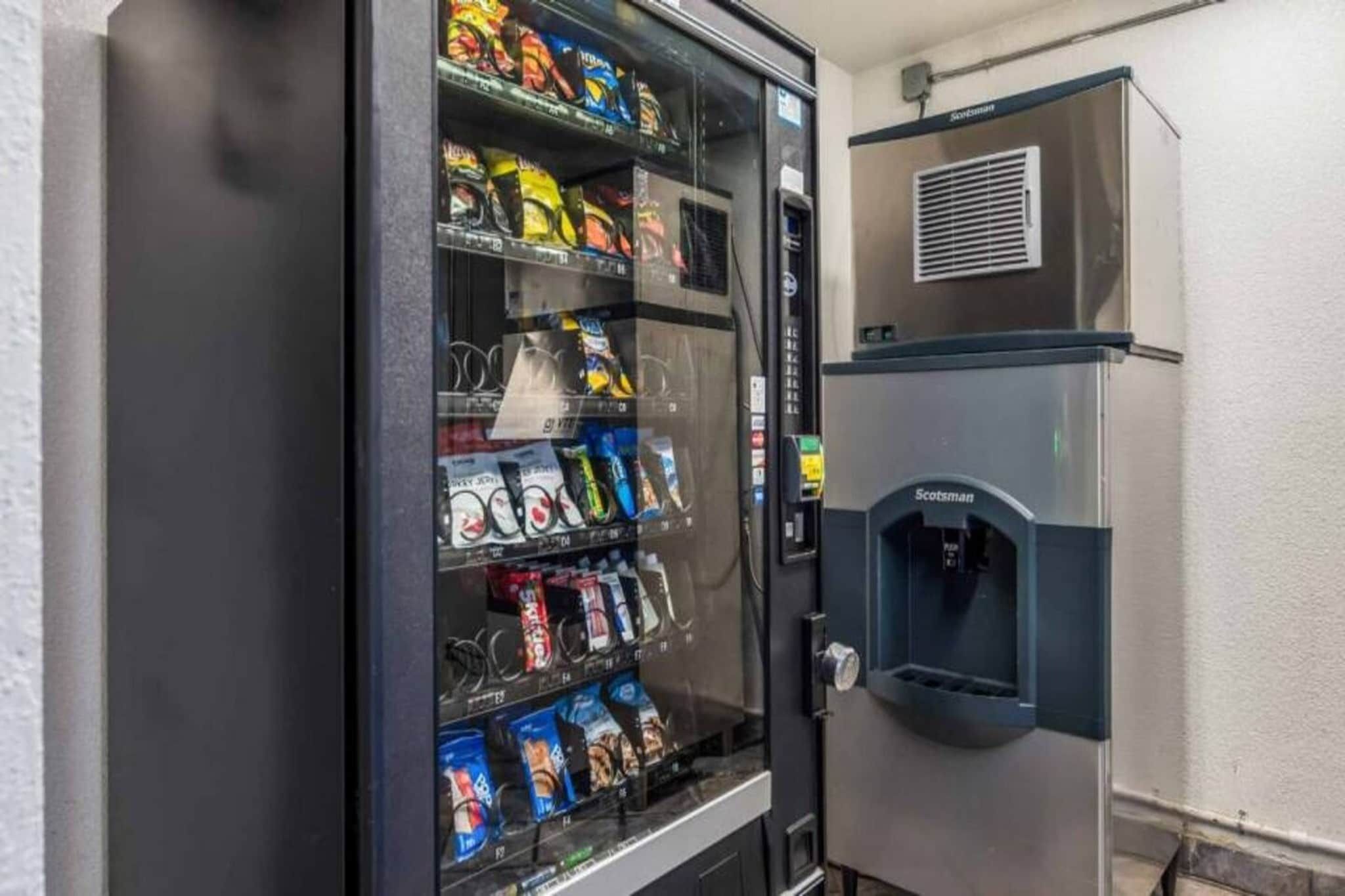 A vending machine stocked with snacks and a water dispenser.