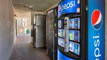 A vending machine with Pepsi branding and a selection of beverages.